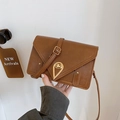 Retro brown envelope crossbody bag with a golden teardrop lock and matte finish - Brown