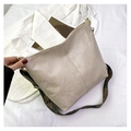 Detail of beige faux leather tote with vertical stitching and bohemian woven shoulder strap - Khaki