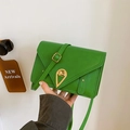 Vibrant green patent leather crossbody bag with unique gold teardrop lock and adjustable strap - Green