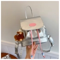 Detail of silver metallic mini backpack with pink drawstring and cute plush charm - Silver