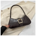 Detail of dark brown crescent underarm bag with vintage gold buckle on velvet fabric - Brown