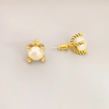 Elegant gold spiral stud earrings with white pearls and sparkling diamond accents - Gold
