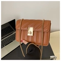 Detail of brown quilted bag with gold chain strap and metallic twist lock closure - Brown