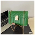 Detail of bright green quilted small square bag with gold twist lock and chain strap - Green