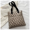 Champagne gold quilted tote bag with black straps and glossy down texture finish - Gold