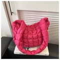 Close-up of bright pink quilted puffer bag with 3D bubble texture and soft nylon fabric - Rose Pink