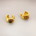 Polished 18k gold plated C-shaped earrings with inlaid brown tiger eye stone on light grey background - Gold