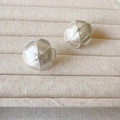 Elegant silver matte flower earrings with freshwater pearl centers on a textured beige tray - Round Leaf (GY2293284) / Silver