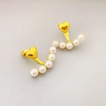 Elegant gold heart earrings with S-curve white pearl drops on a clean grey background - Gold