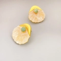 French shell-shaped gold earrings with turquoise rhinestones on gray background - Pink