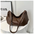 Deep brown minimalist hobo bag with pebble leather texture and golden metal rings - Coffee Without Charm