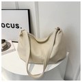Close-up of cream soft PU leather tote bag with wide strap and zipper closure - White Without Pendant