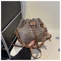 Detail of plaid wool bucket bag featuring leather drawstring and woven handle - With Plush Pendant Style / Coffee