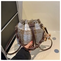 Close-up of wool plaid bucket bag featuring drawstring closure and brown bear charm - With Plush Pendant Style / Blue