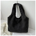 Detailed texture of black corduroy tote bag showing fine vertical stripes and material - Black