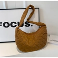 Close-up of dark brown quilted nylon hobo bag with diamond stitching and smooth texture - Brown