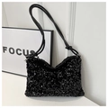 Detail shot of shimmering black sequins on shoulder bag with tied leather strap design - Black