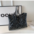 Glossy black quilted down tote bag for women with golden buckle and sleek shoulder straps - Black