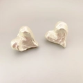 Vintage heart shaped stud earrings with silver textured finish and minimalist aesthetic - Silver