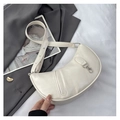 Detail of cream crescent bag with pleated texture and adjustable silver buckle strap - Off White