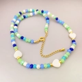 Colorful beaded necklace with white heart charms, gold lobster clasp and adjustable chain - Multicolor Beaded Style