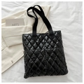 Black quilted puffer tote bag with glossy finish and soft diamond stitching texture - Black