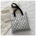 Chic silver quilted puffer tote bag with black handles and metal texture finish - Silver