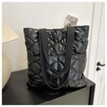 Quilted black puffer tote bag with glossy finish and durable webbing handles for daily use - Black