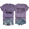 Detail of purple V-neck T-shirt with Be Kind print and distressed denim shorts - S / Purple