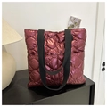Quilted tote bag in metallic burgundy finish with black fabric handles and diamond patterns - Red