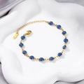 18K gold plated stainless steel bracelet with 6mm round sparkling blue glitter stones - Gold Blue