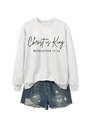 Detail of Christ is King grey sweatshirt with Revelation text and ripped denim shorts - Off-White (Black Font)