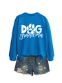 Detail of royal blue Dog Grandma sweatshirt with heart paw print and ripped denim shorts - Lake Blue