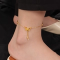 Elegante goudkleurige vlinder enkelband van titaniumstaal met glanzende strass kwastjes - Holle Strik Kwastje Stijl / Goud