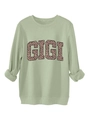 Macro shot of GIGI leopard print detail on sage green crewneck sweatshirt fabric - Olive Green