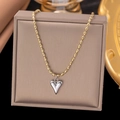 Two-tone gold and silver heart necklace featuring a beaded chain on a premium jewelry display - Gold Chain Silver Heart (Two-tone)