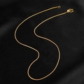 Golden titanium steel snake chain necklace with M-clasp on premium black background - Round Snake Chain / 45cm / Gold