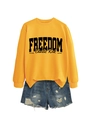 Detail of yellow Freedom Charlie Kirk sweatshirt with ribbed collar and denim shorts - Yellow Sweatshirt (Black Font)