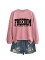 Detail of pink sweatshirt with black Freedom text and Charlie Kirk signature print - Rose Gold Sweatshirt (Black Font)
