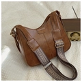 Detail of retro brown leather bag with wide embroidered strap and vintage gold hardware - Brown