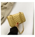 Elegant gold quilted chain bag with V-shaped stitching and metallic turn-lock closure - Gold