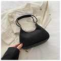 Detailed close-up of a black crescent bag featuring sparkling rhinestones and chain strap - Black