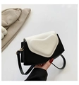 Detail of black and white leather heart bag with gold metal buckle and leather strap - Black