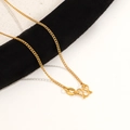 Golden titanium steel Chopin chain necklace with M-clasp and oval tag on black velvet - M-buckle Curb Chain / 45cm / Gold