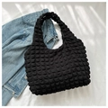 Close-up of black bubble textured tote bag with soft 3D embossed pleated surface fabric - Black