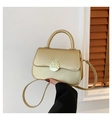 Minimalist golden square handbag with metallic circular buckle and sleek handle - Gold