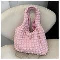 Detailed close-up of a pink bubble fabric tote bag featuring unique 3D textured material - Pink