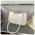Minimalist cream white underarm bag on display with elegant gold hardware and stitching - White
