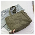 Detail of olive green quilted nylon tote bag with rhombus pattern and soft padded texture - Green