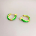 Macro detail of gold hoop earrings with neon green enamel and cubic zirconia stones - Green